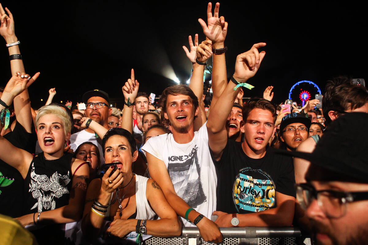 Fans cheer as Imagine Dragons performs during the Life is Beautiful festival in downtown Las Ve ...