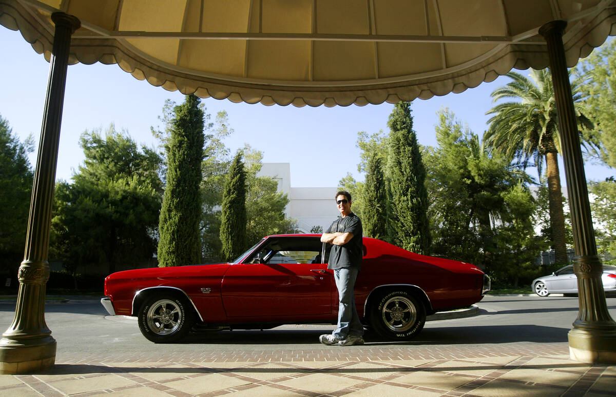 Entertainer Danny Gans, who headlines at the Mirage hotel-casino, stands next to his 1970 Cheve ...