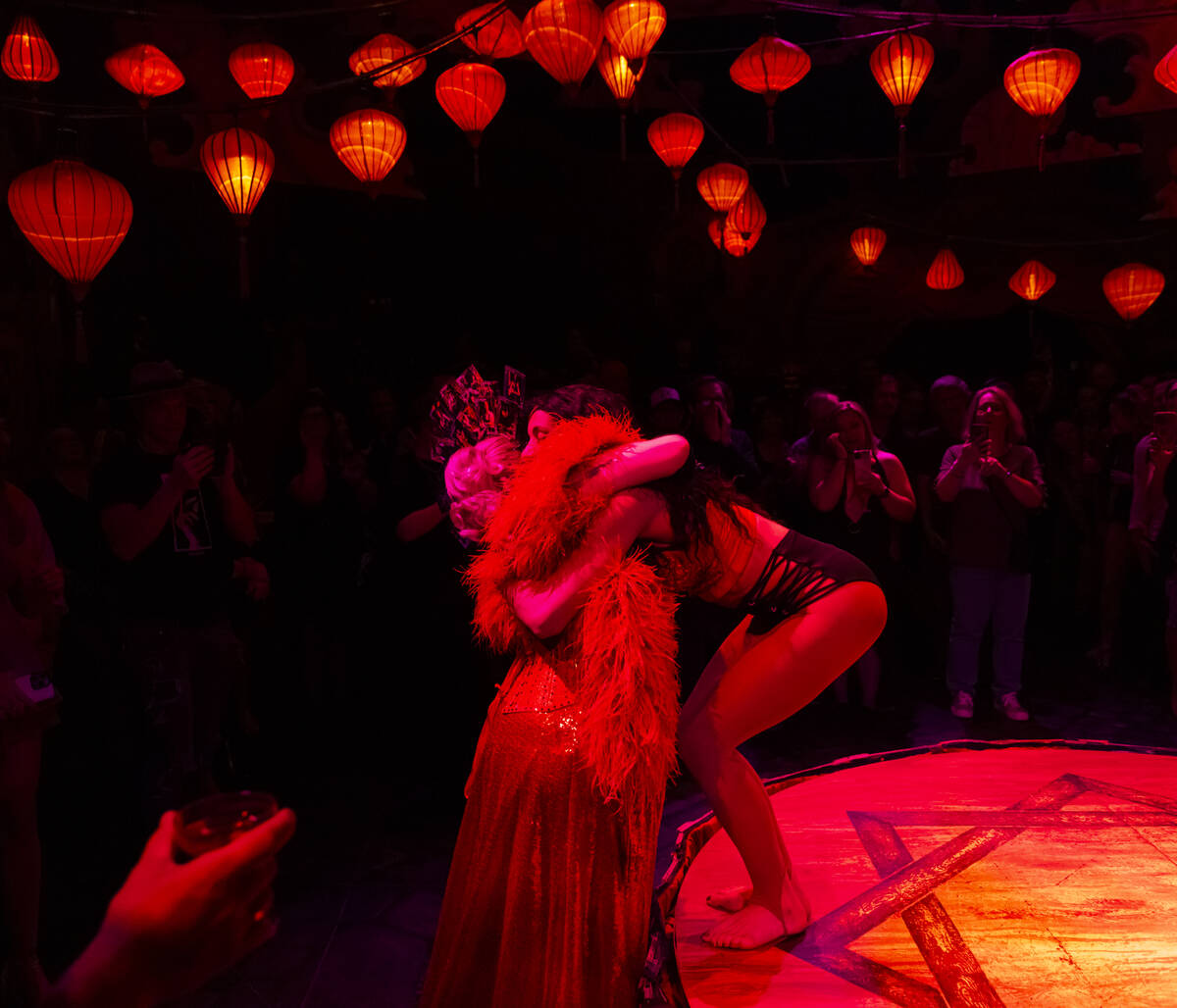 Artistic director and dancer Patricia Bouchebel, right, hugs singer and emcee Cora Vette after ...