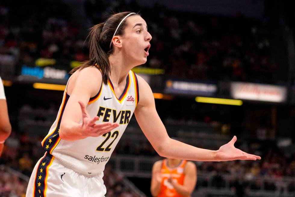 Indiana Fever guard Caitlin Clark (22) questions a call in the first half of a WNBA basketball ...