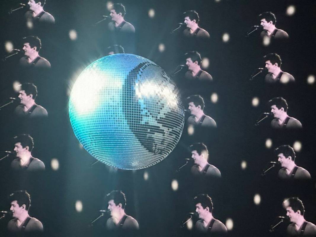 John Mayer and a Grateful Dead disco ball are shown during Dead & Company's opening night at th ...