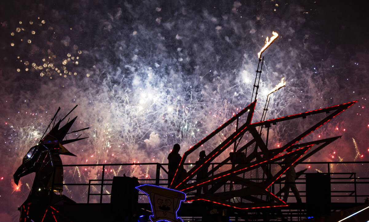 Attendees watch as fireworks go off during the first night of the Electric Daisy Carnival at th ...