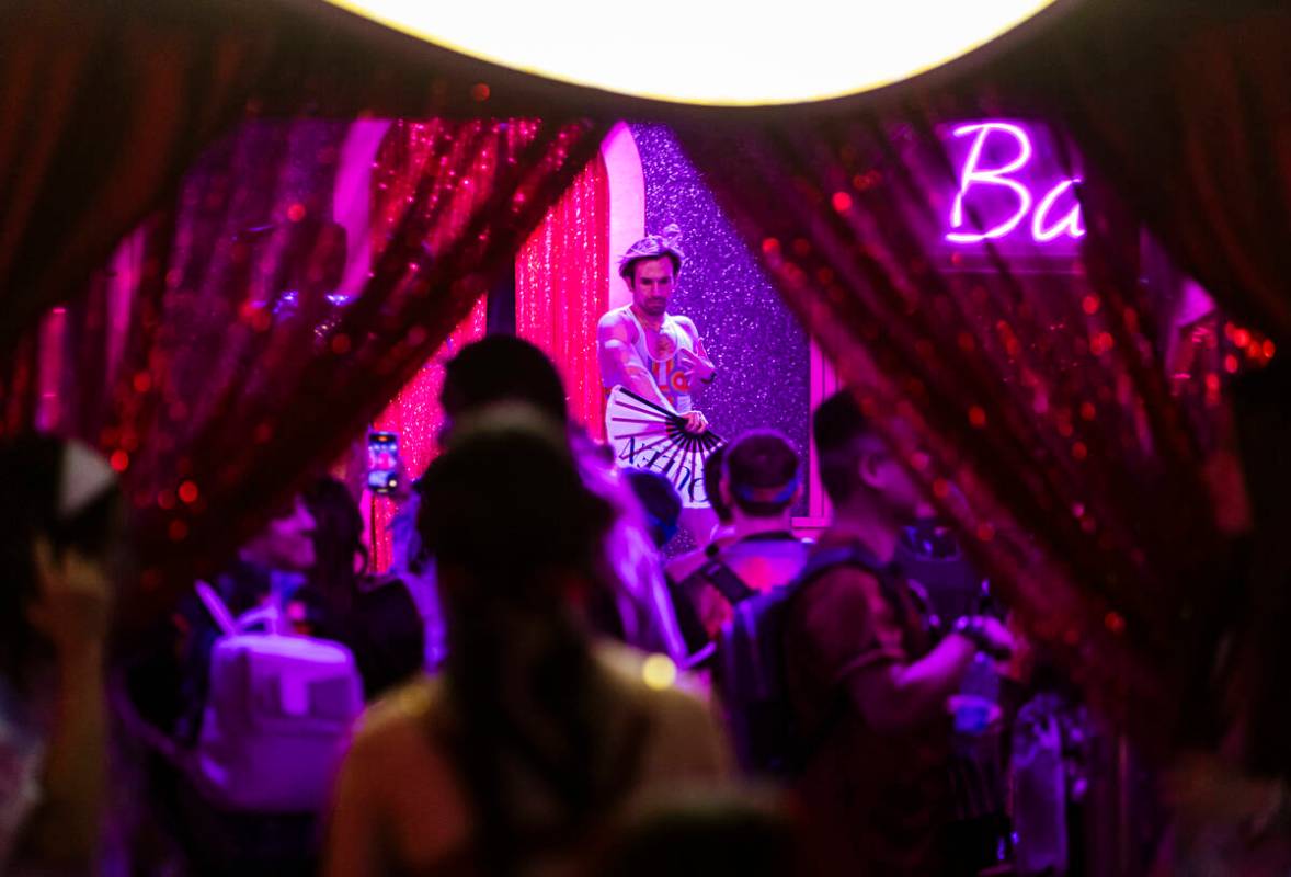 A dancer entertains the crowd at the Queen Bar during the first night of the Electric Daisy Car ...