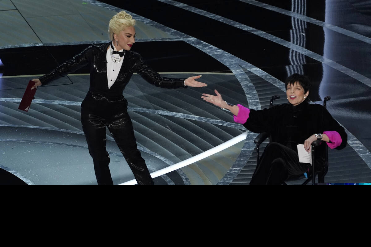 Lady Gaga, left, and Liza Minnelli present the award for best picture at the Oscars on Sunday, ...