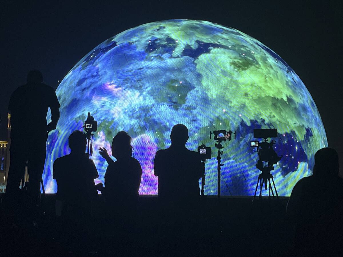 People watch the Sphere July 4th fireworks show on Tuesday, July 4, 2023, in Las Vegas. (James ...