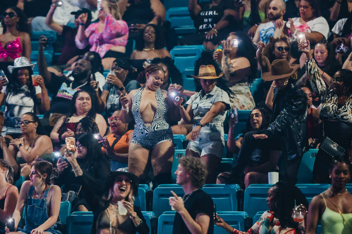Fans dance to music before Megan Thee Stallion takes the stage during the Hot girl Summer Tour ...