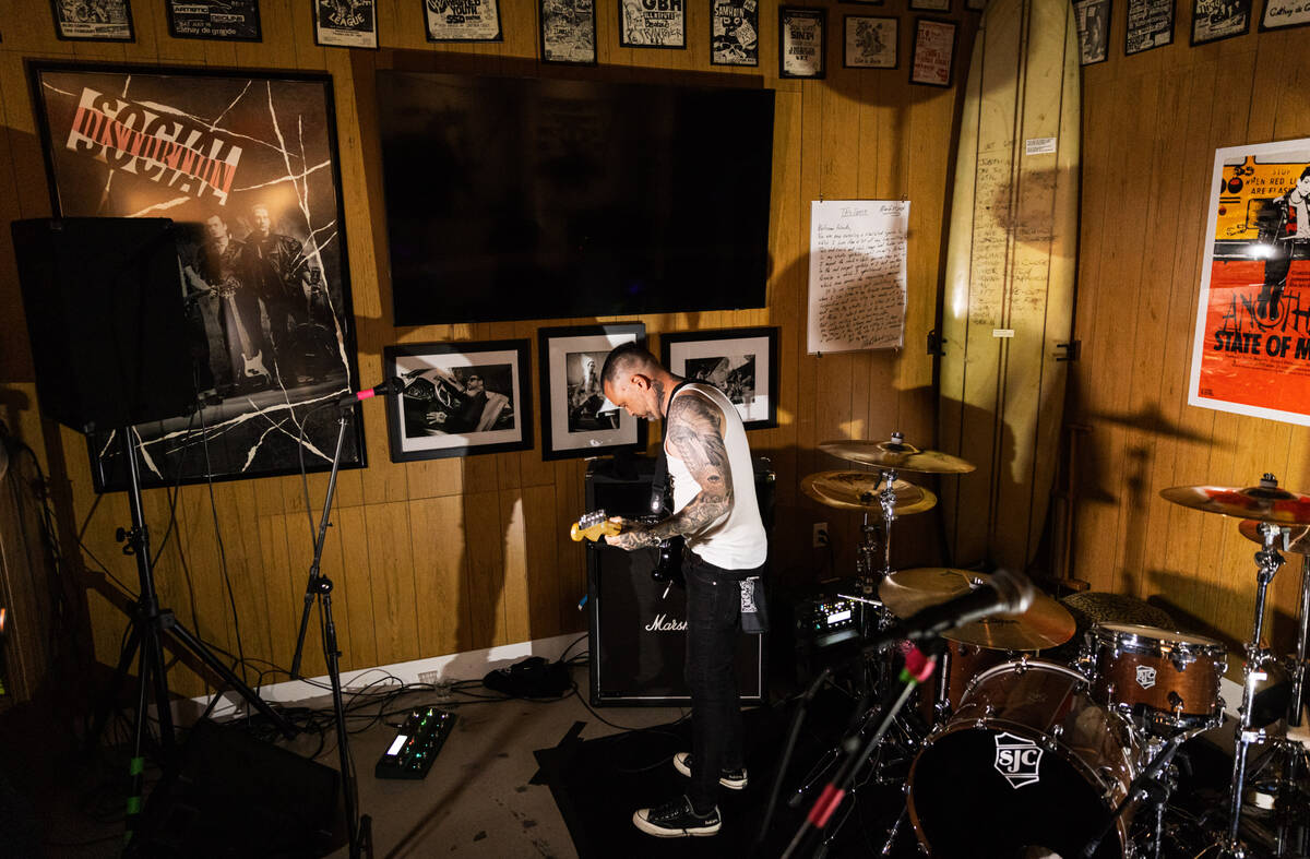 Tim Stewart, of Damnage, prepares to perform at the Punk Rock Museum on Friday, June 28, 2024, ...
