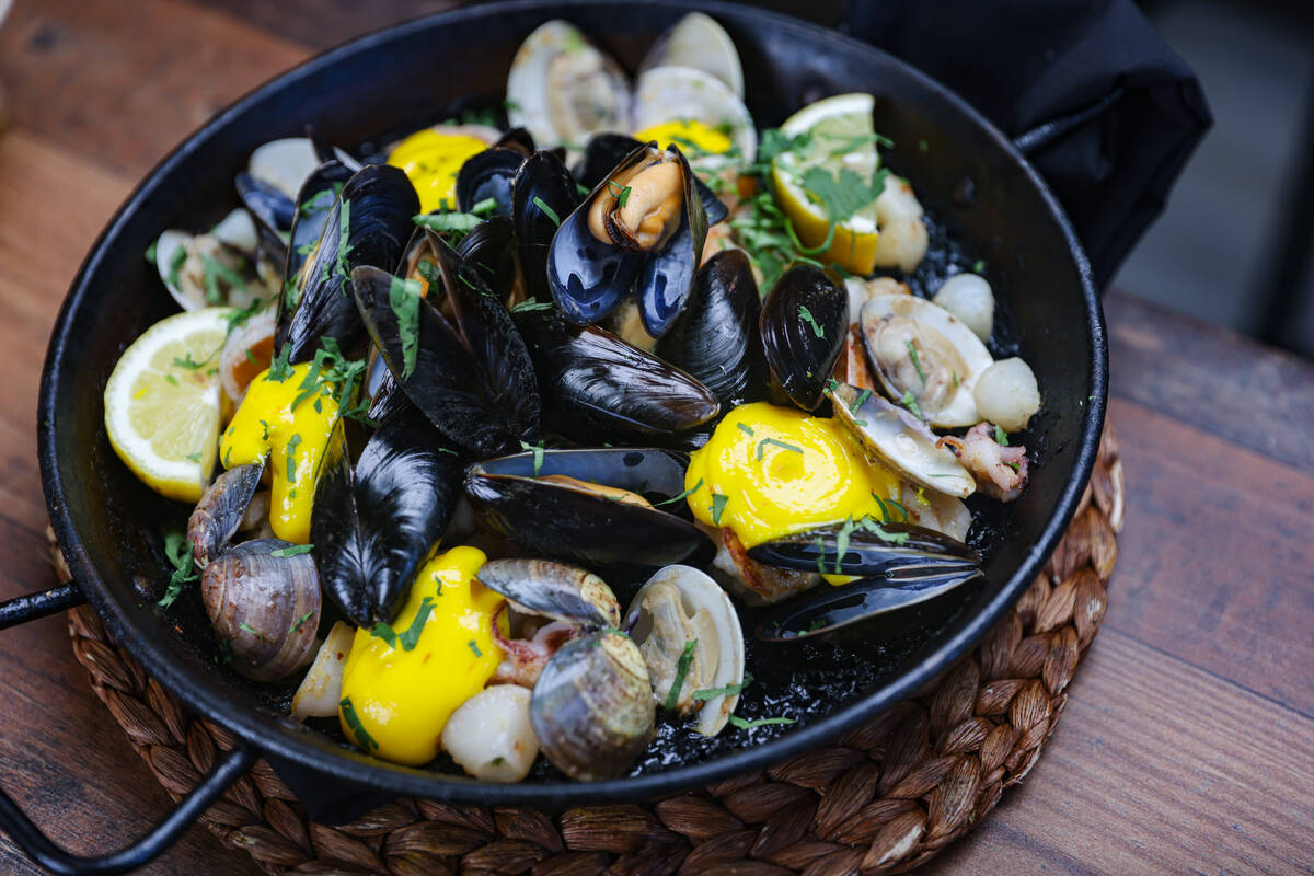 Seafood paella from Chef Rafael Salines-Catalá at his Jamón Jamón Wood Fired Kitchen, a tapa ...