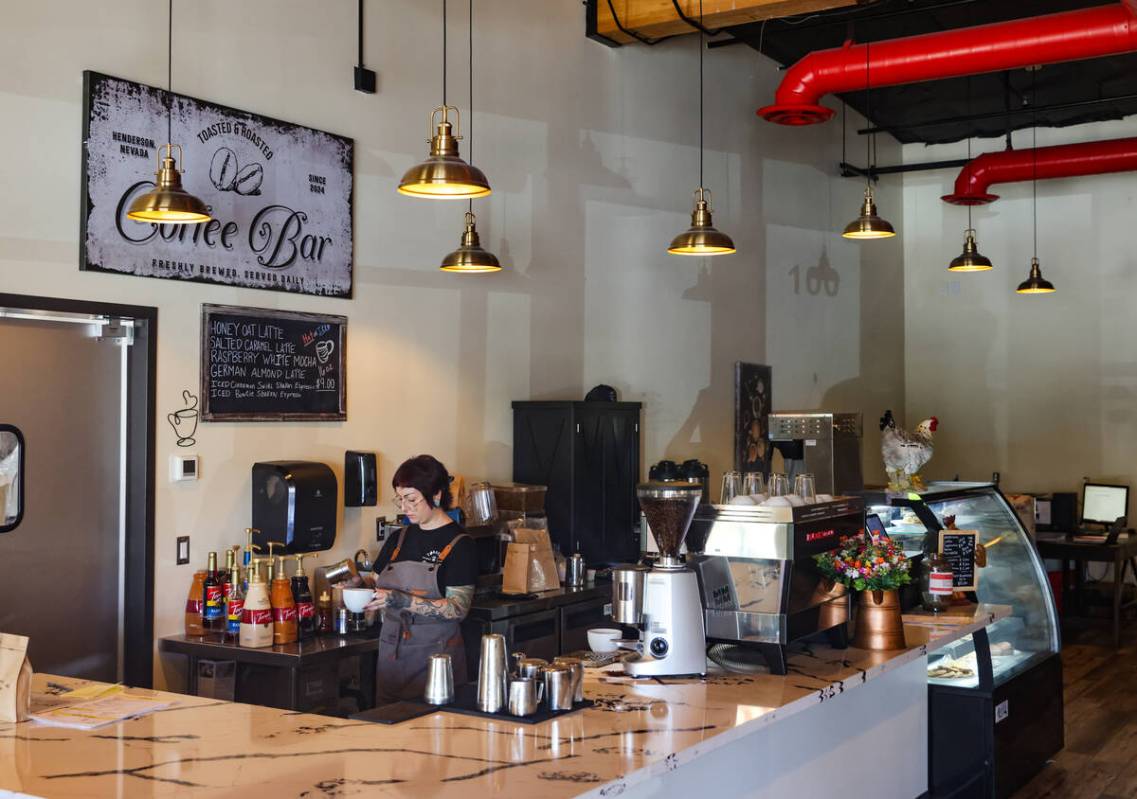 Barista Audrey Bogle makes a drink for a customer at Toasted & Roasted, an American breakfast a ...
