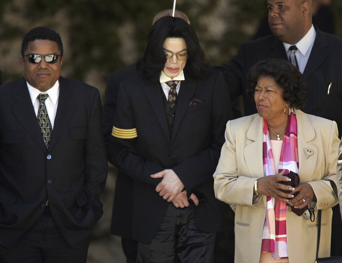 FILE - Pop star Michael Jackson, center, his mother Katherine Jackson, right, and brother Tito ...