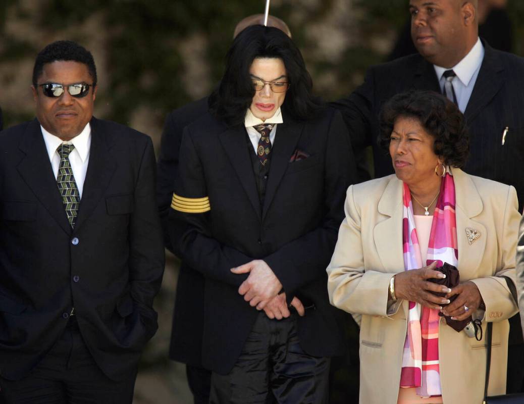 FILE - Pop star Michael Jackson, center, his mother Katherine Jackson, right, and brother Tito ...