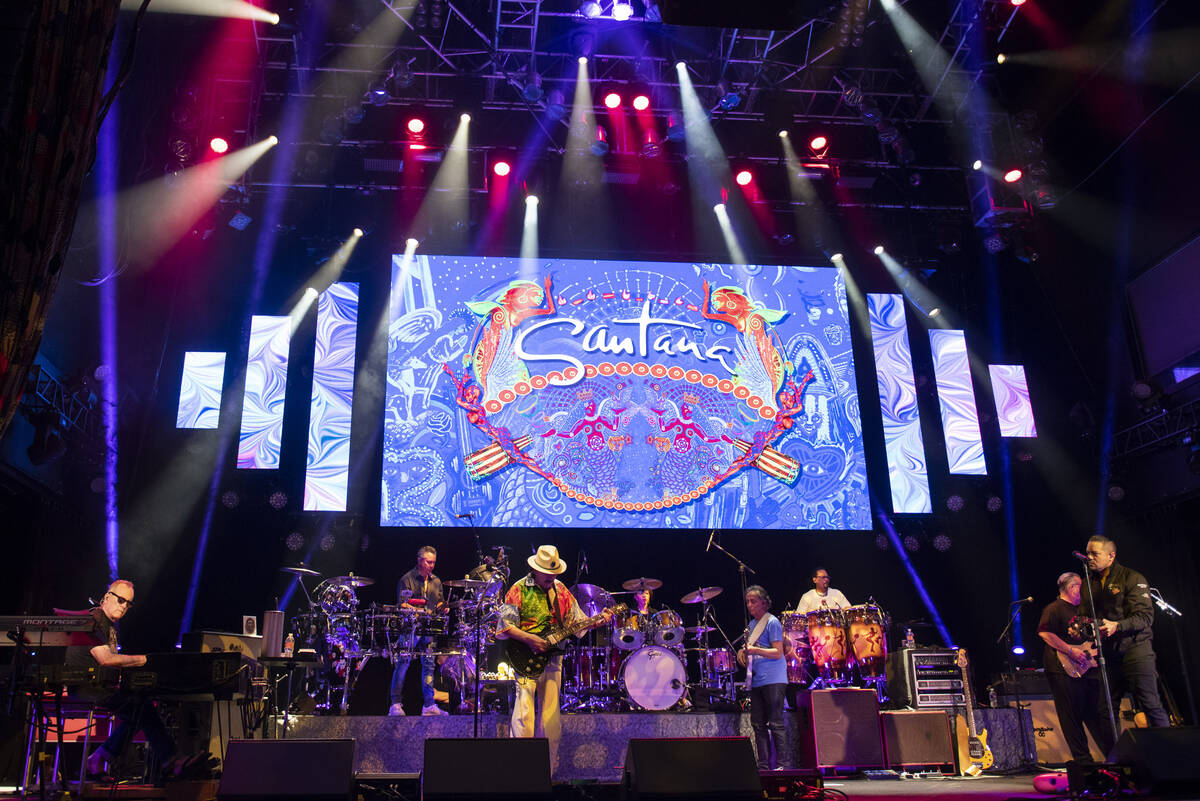 Carlos Santana performs a sound check after a press conference to announce an extension of Sant ...
