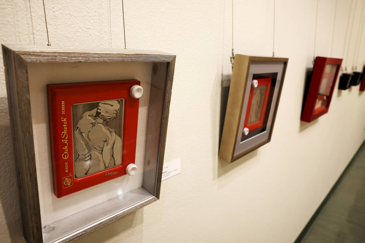 Works of art using Etch-A-Sketch toys, including The Reach by Andrea Tilden, left, are on displ ...