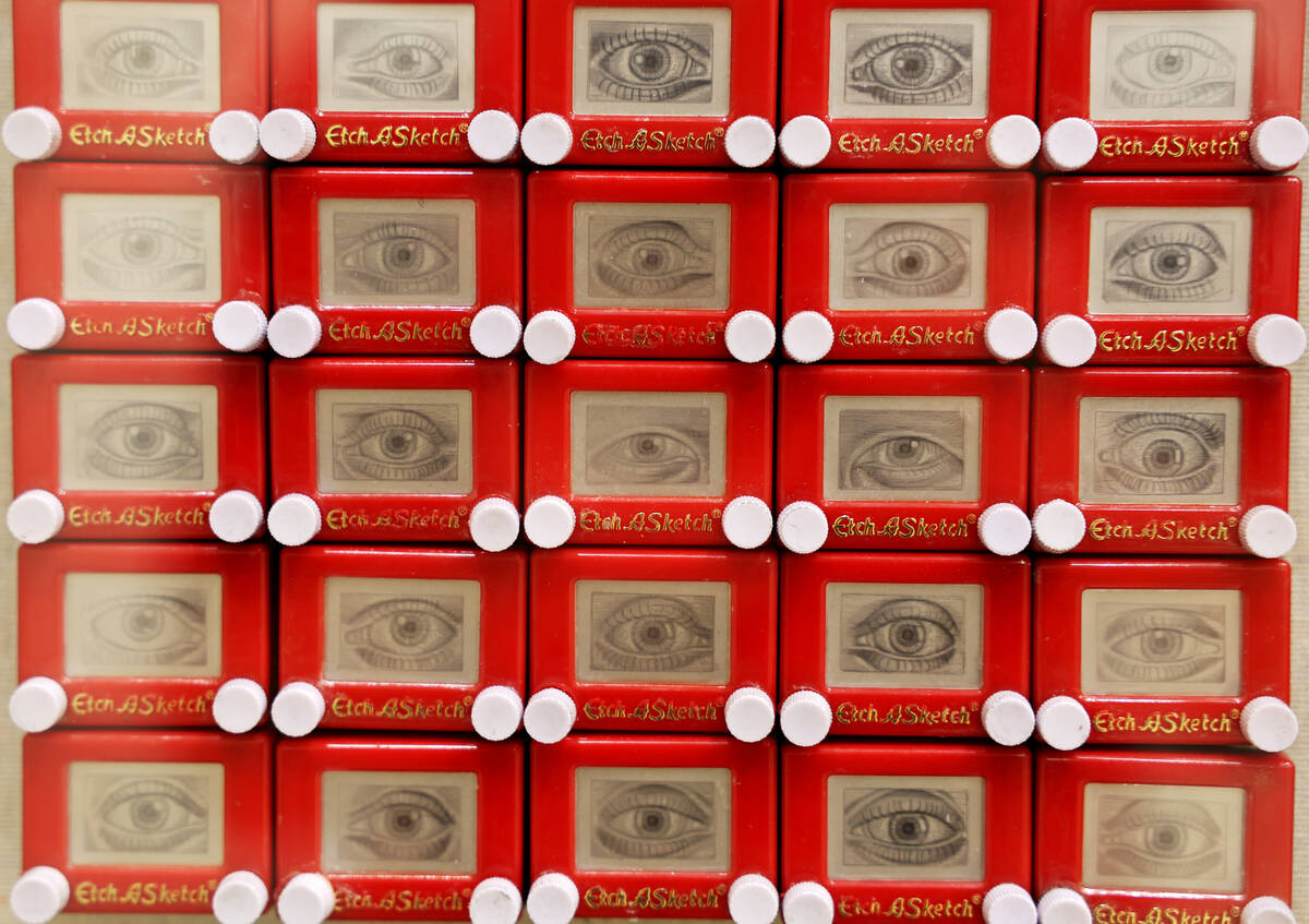 Works of art using Etch-A-Sketch toys, including 24 Million by Mark Paich, are on display in th ...