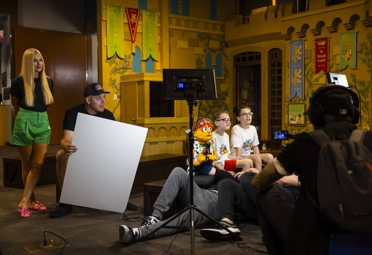 Andy Walmsley, center, puppeteers Artie alongside Dylan Lux, 10, center right, and Dexter Lux, ...