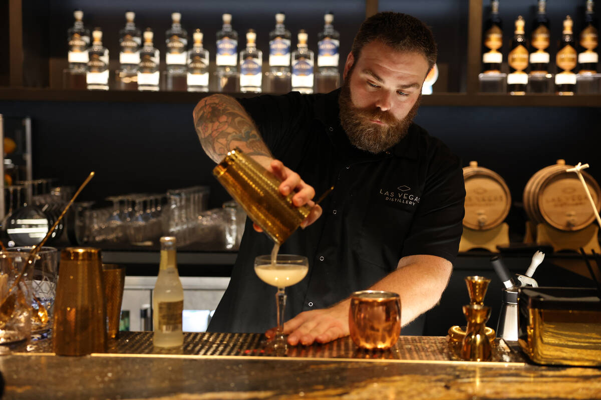 Tasting room and brand mixologist Cody Fredrickson pours a cocktail at Las Vegas Distillery in ...