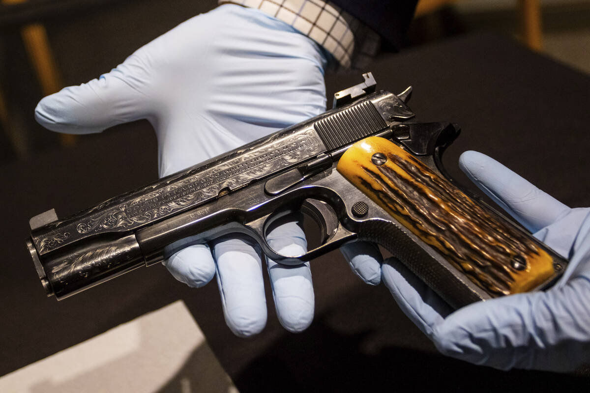 This photo taken Monday, Dec. 23, 2024, in Las Vegas shows a Colt .45-caliber pistol that once ...