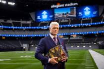 WWE superstar Cody Rhodes poses with the Undisputed WWE Championship belt at Allegiant Stadium ...