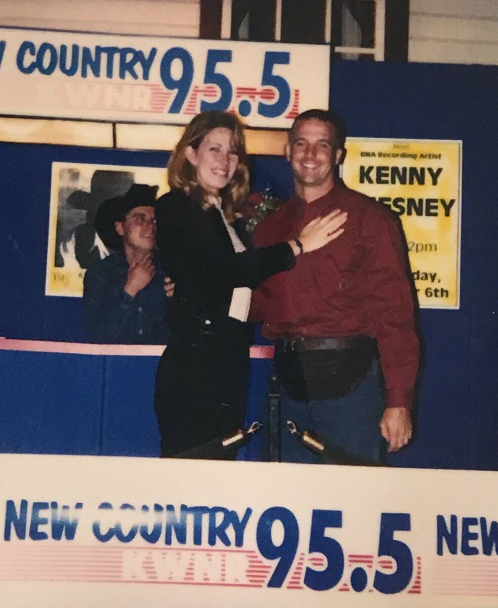 Dane and Lisa Mattoon hug after Dean's proposal at Texas Station on Nov. 9, 1996. Budding count ...