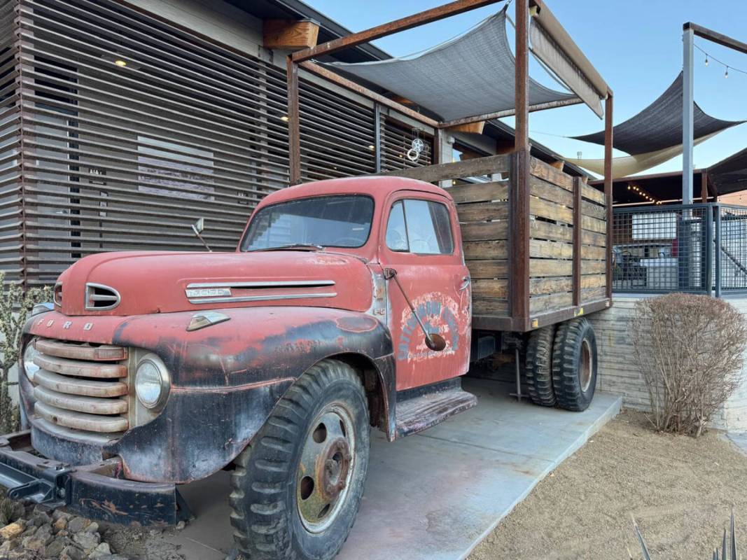 An old mining truck, with dining in its flatbed, at Cottonwood Station, a restaurant in Blue Di ...