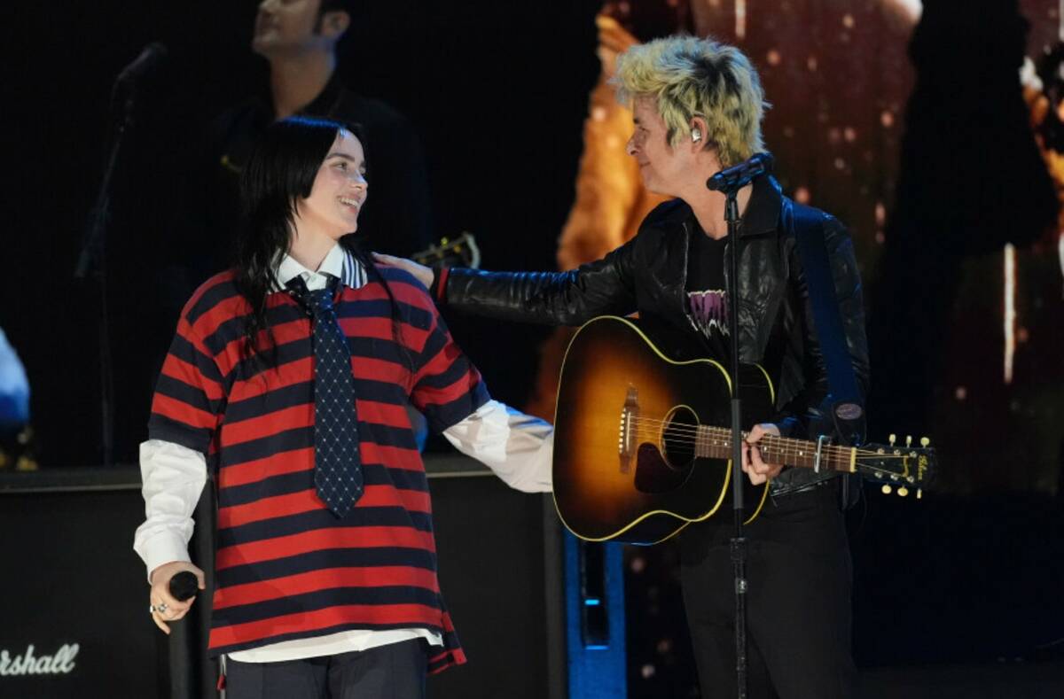 Billie Eilish, left, performs with Billie Joe Armstrong of Green Day during the FireAid benefit ...