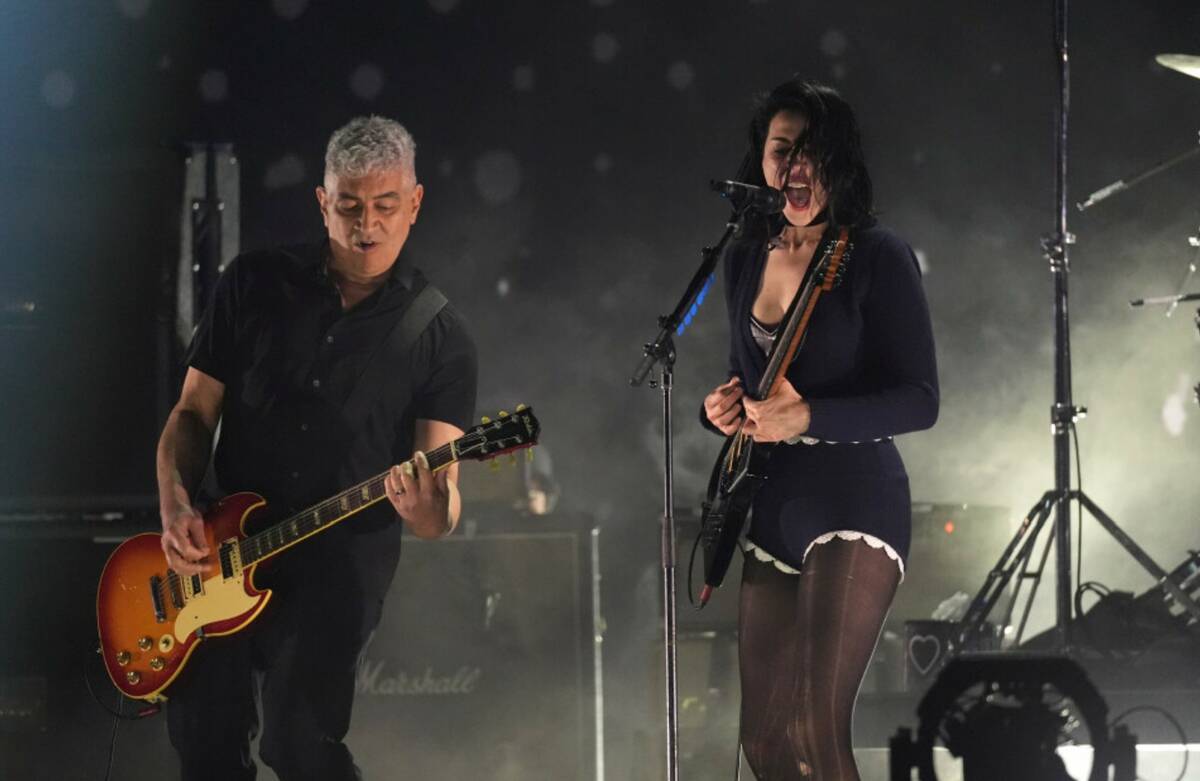 St. Vincent, right, performs with Pat Smear of Nirvana during the FireAid benefit concert on Th ...