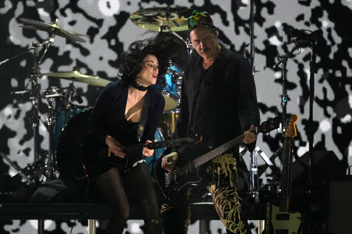 St. Vincent, left, performs with Krist Novoselic of Nirvana during the FireAid benefit concert ...