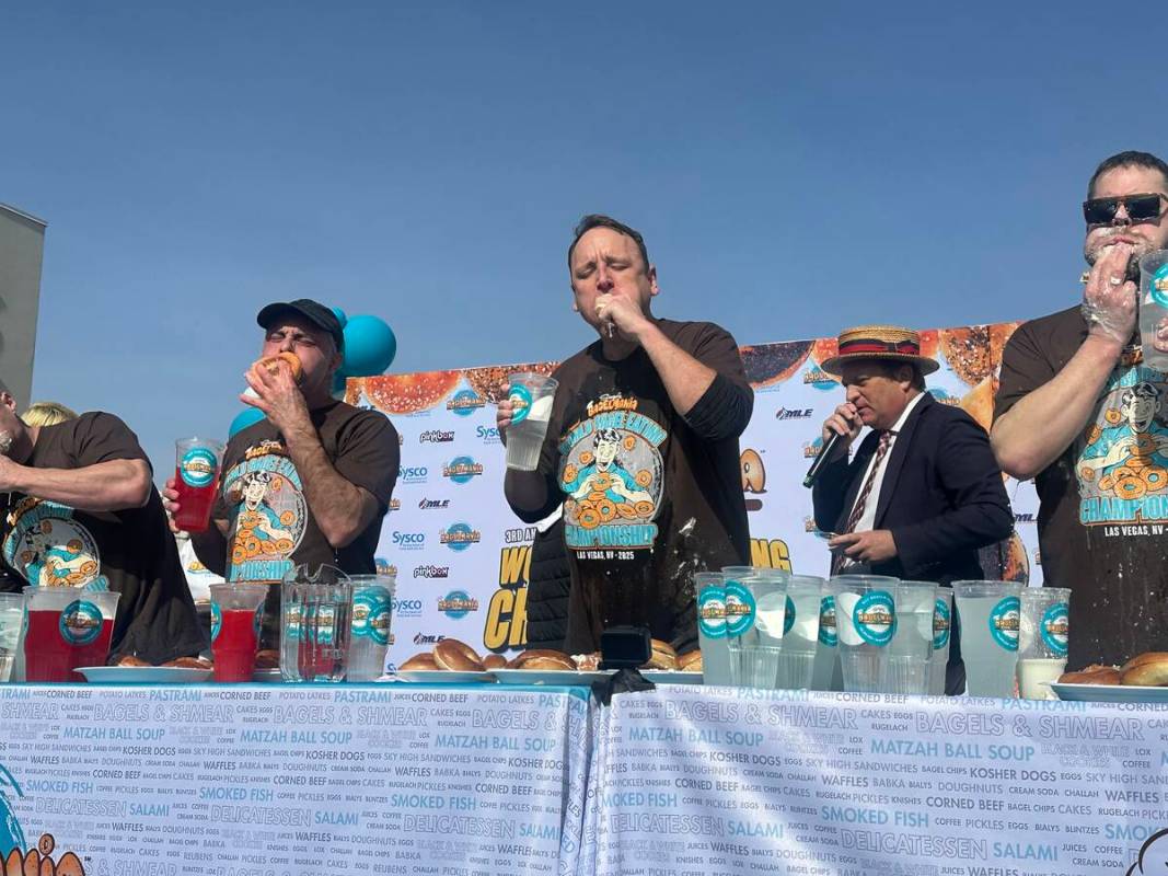 Joey Chestnut, center, competes against Nick Wehry, left, and Patrick Bertoletti in the third a ...