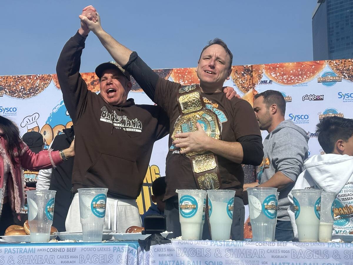 Siegel's Bagelmania owner Steven Siegel celebrates Joey Chestnut's Joey Chestnut's victory in t ...