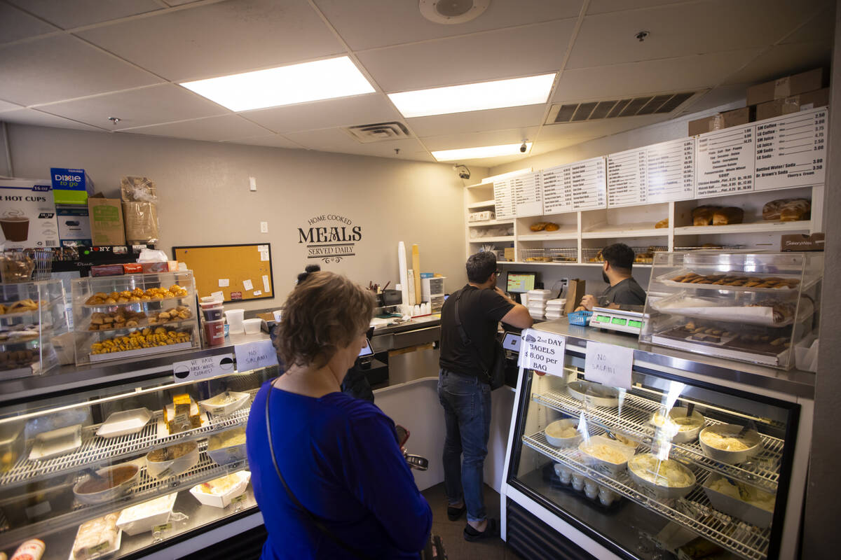 People place orders in the bakery area at Weiss Deli, soon to be Fisher’s Deli, on Thurs ...