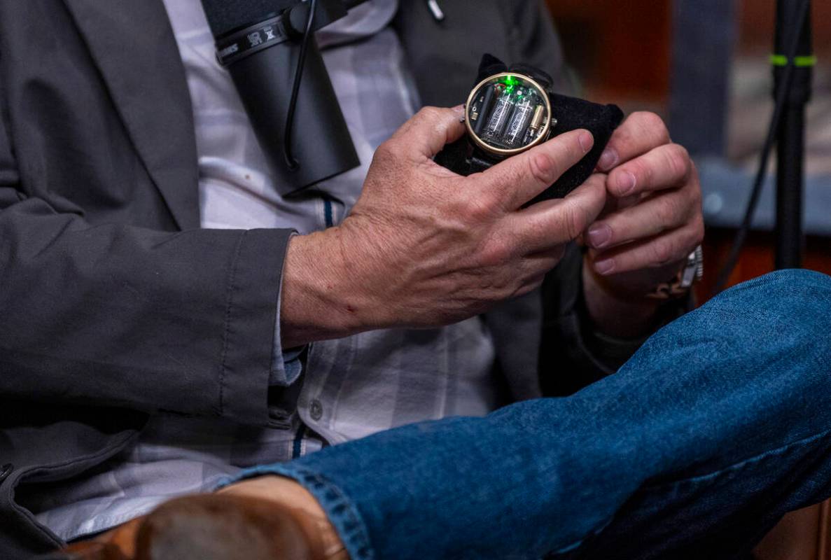 Rick Harrison holds a FALLOUTFITTERS watch given to him by guest former UFC champ Chuck Liddell ...