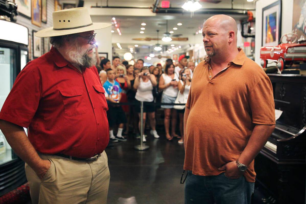 Mark Hall-Patton, left, talks with Gold & Silver Pawn owner Rick Harrison in an undated ph ...