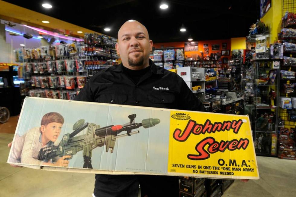 Toy Shack owner Johnny Jimemez displays one of his favorite toys, a 1960s era Johnny Seven OMA ...