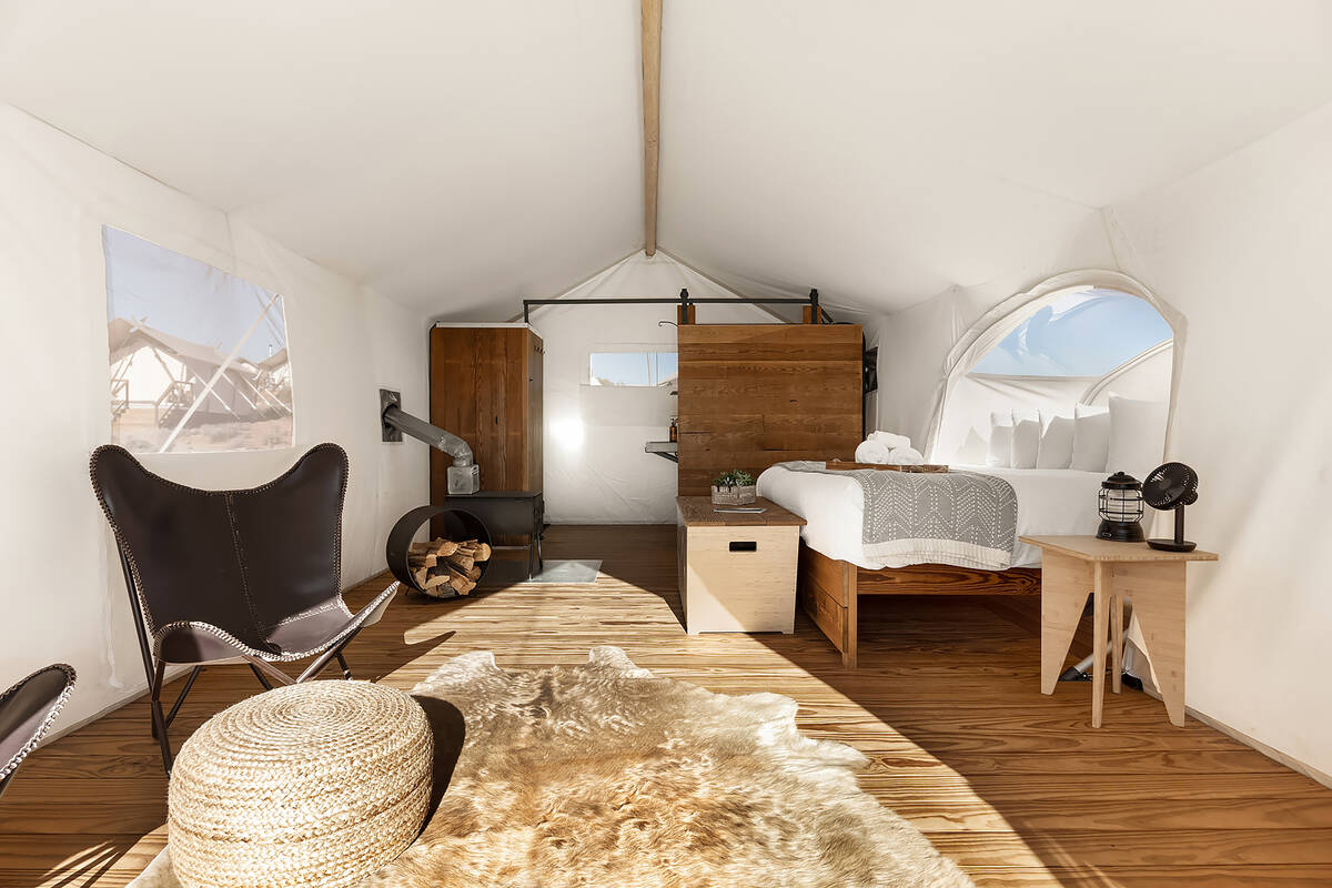 Each safari-inspired stargazing tent is equipped with plush bedding, upgraded linens, a private ...