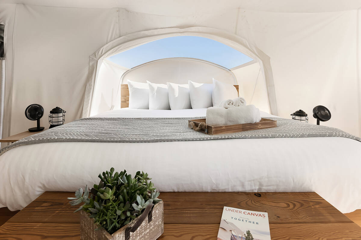 Each safari-inspired stargazing tent is equipped with plush bedding, upgraded linens, a private ...