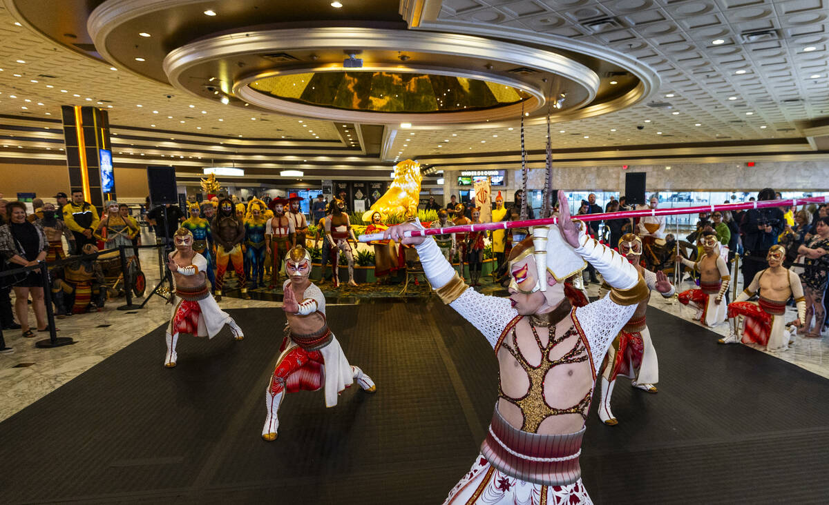 Performers with “Ka” conduct a small celebration performance in the grand lobby of ...