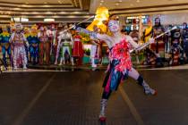 Performers with “Ka” conduct a small celebration performance in the grand lobby of ...