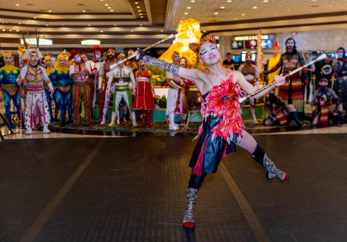 Performers with “Ka” conduct a small celebration performance in the grand lobby of ...