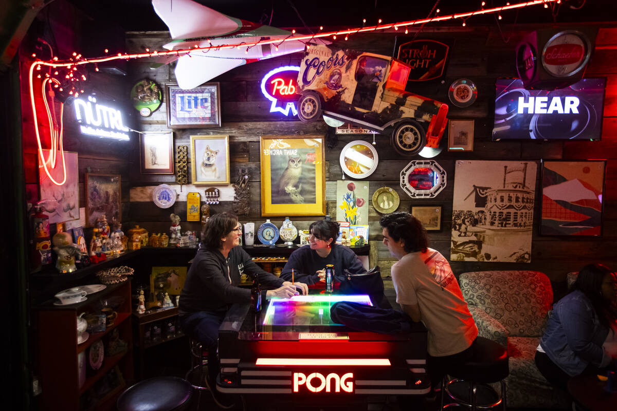 Randy Schifflin, from left, Alex Solis, and Jacob Solis participate in trivia night at ReBAR on ...