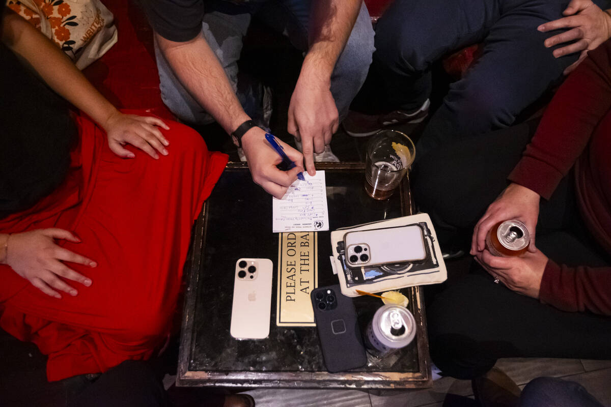 People participate in trivia night at ReBAR on Monday, Feb. 24, 2025, in Las Vegas. (Chase Stev ...