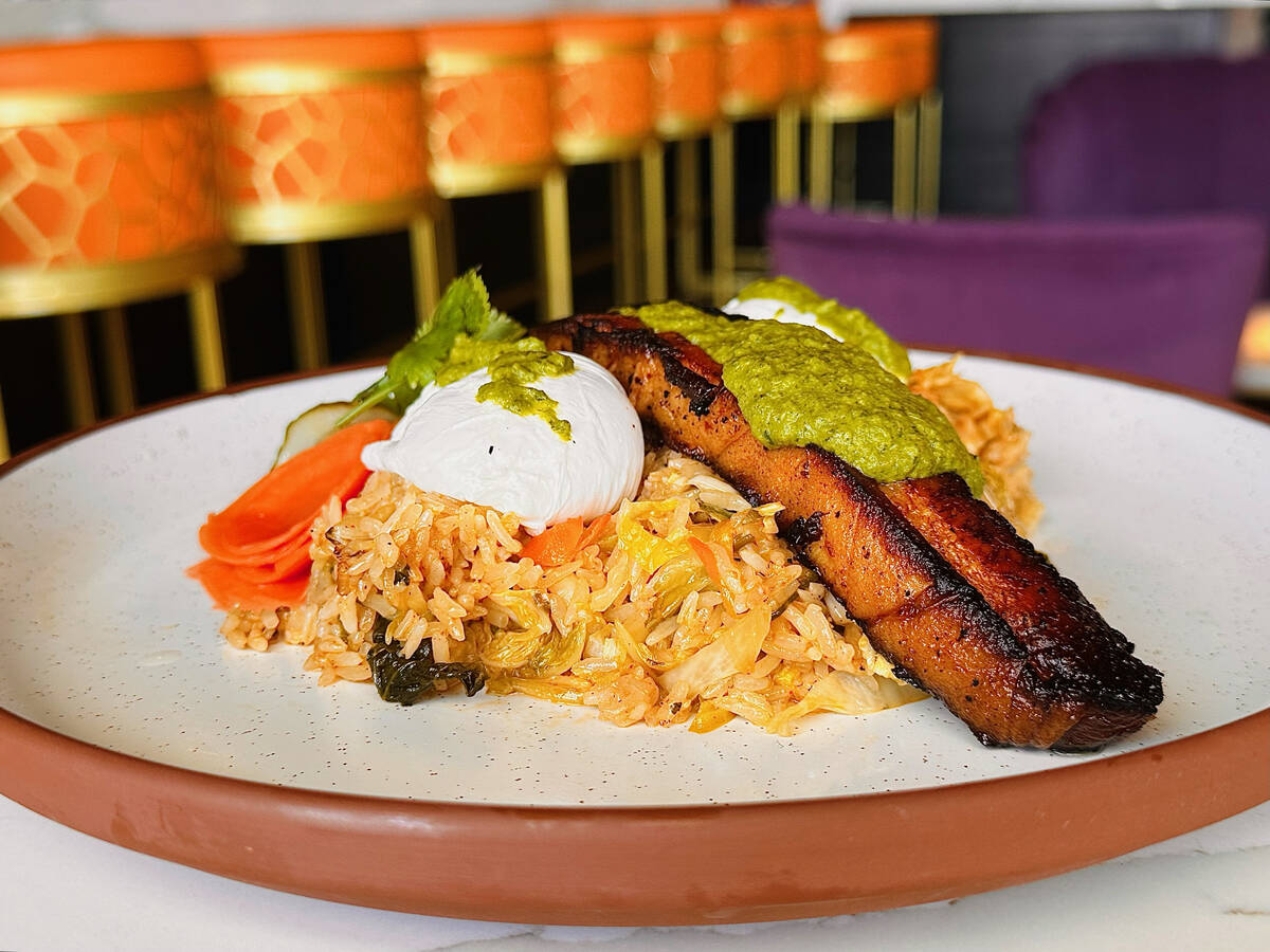 Roasted pork belly with fried rice and eggs from the new brunch menu introduced in February 202 ...