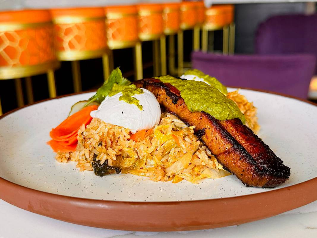 Roasted pork belly with fried rice and eggs from the new brunch menu introduced in February 202 ...