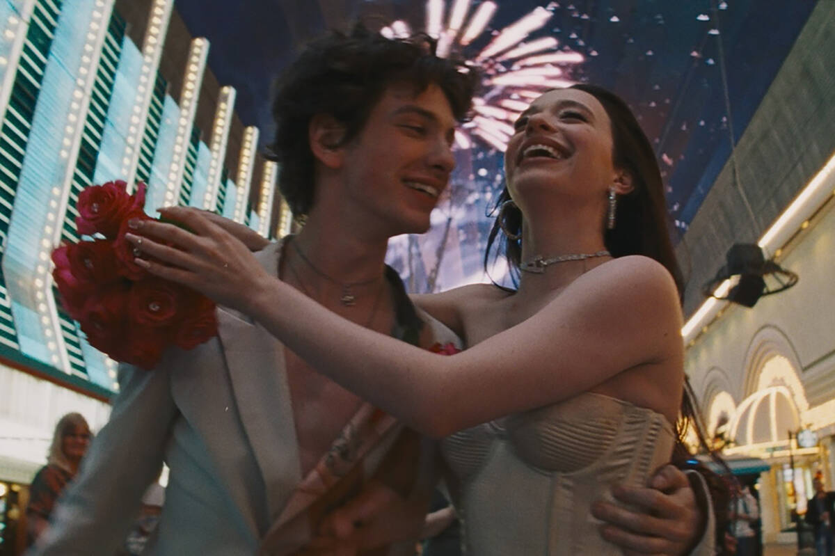 Mark Eydelshteyn as Ivan and Mikey Madison as Ani celebrate their wedding at the Fremont Street ...