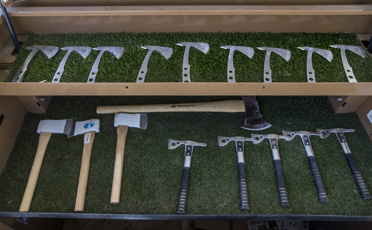 A variety of axes are ready for throwing at Adrenaline Mountain which offers numerous extreme o ...