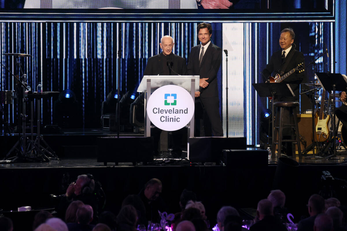 Father Bill Kenny, left, and Jason Bateman speak onstage as Keep Memory Alive hosts star-studde ...