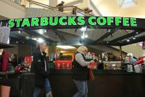 Shoppers at the Walden Galleria in Buffalo, NY, stop by the Starbucks kiosk on Saturday, Nov. 3 ...