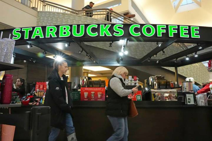 Shoppers at the Walden Galleria in Buffalo, NY, stop by the Starbucks kiosk on Saturday, Nov. 3 ...