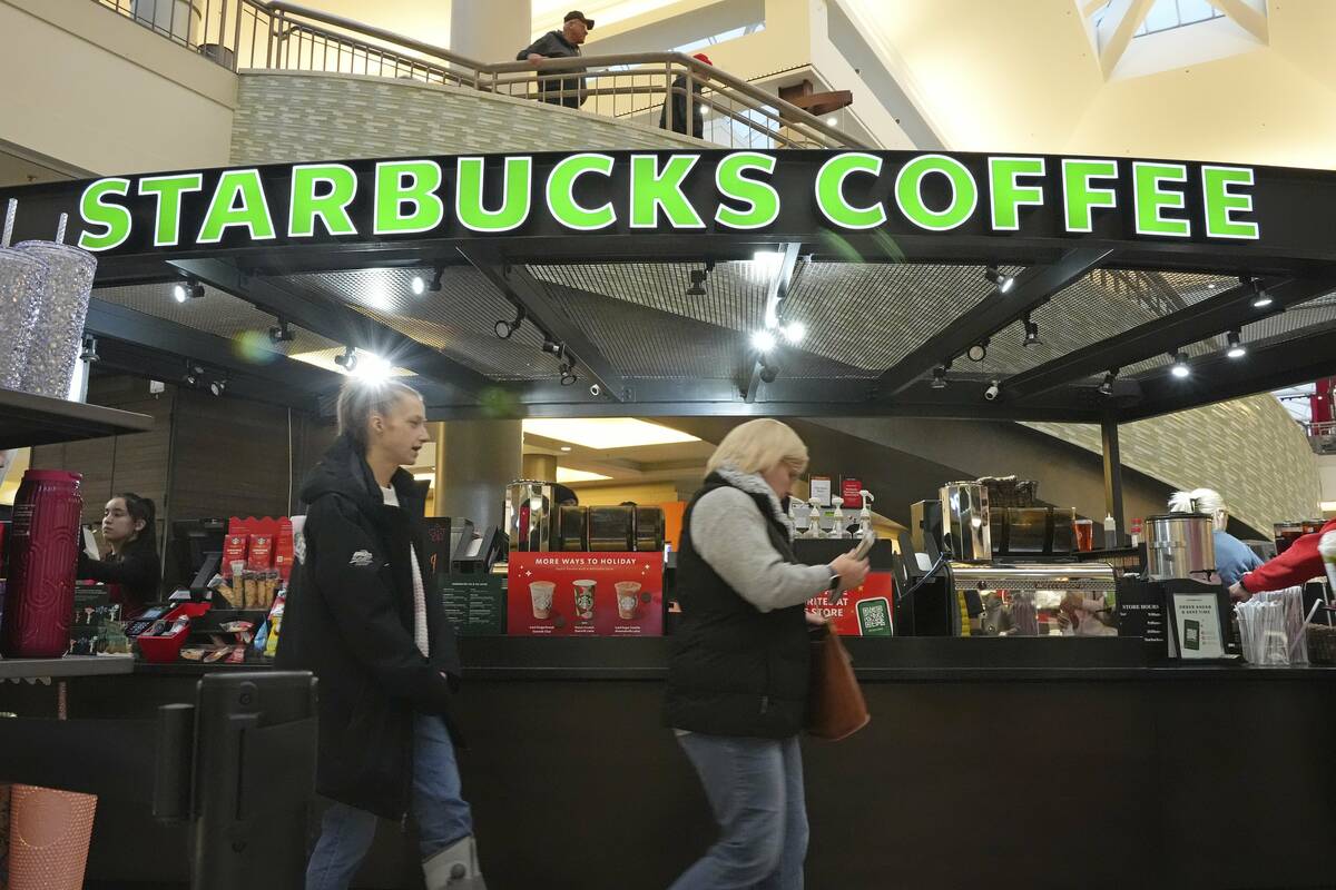 Shoppers at the Walden Galleria in Buffalo, NY, stop by the Starbucks kiosk on Saturday, Nov. 3 ...