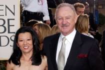 Gene Hackman arrives with his wife, Betsy Arakawa, for the 60th Annual Golden Globe Awards in B ...
