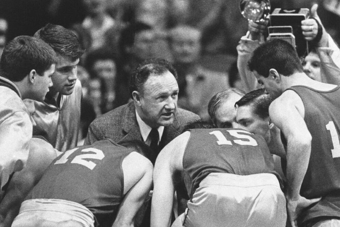 Gene Hackman gives fictional Hickory High basketball players instructions during filming of the ...